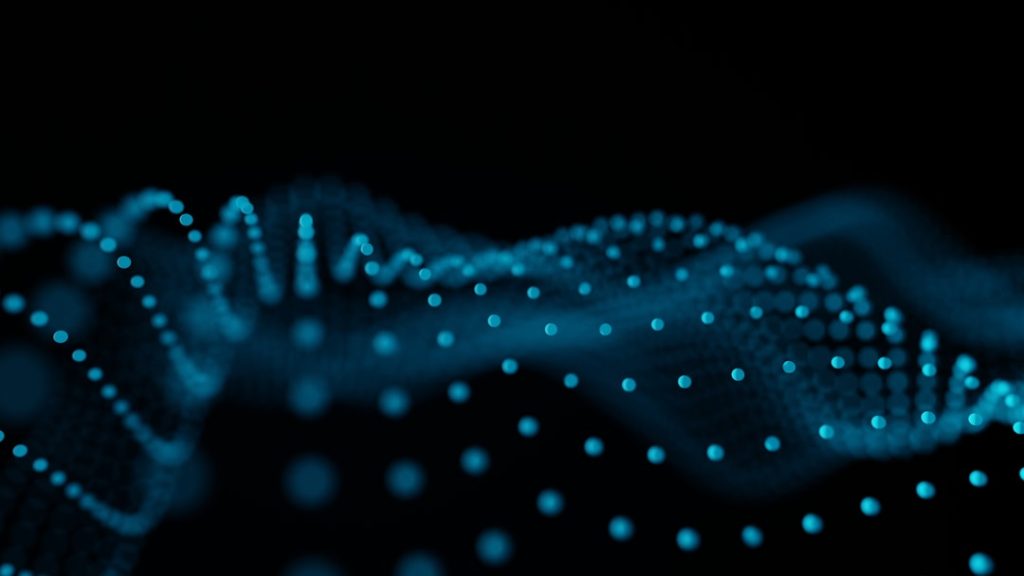 Abstract blue glowing dots forming wave patterns